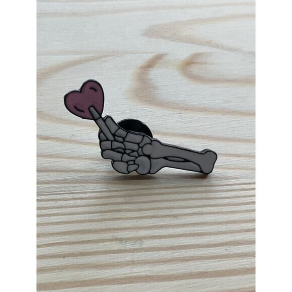Skeleton Hand Enamel Pin Holding Heart - Picture 1 of 3